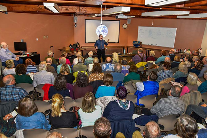 Tim Guinee speaks to an audience about “Climate change, New York, and Hope”